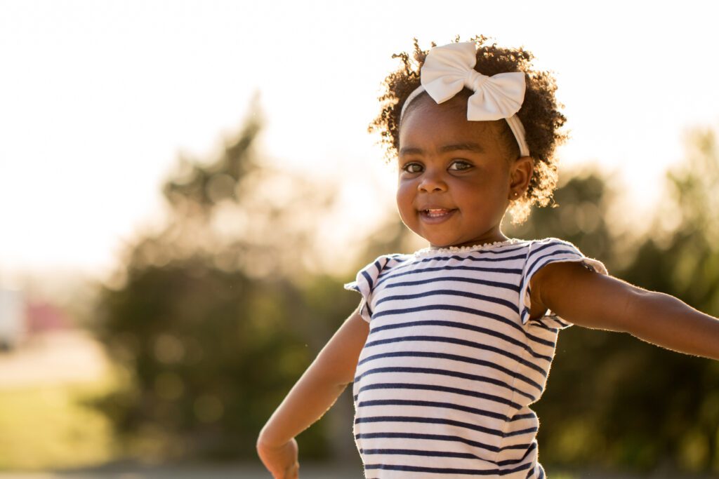 Happy little girl smiling.